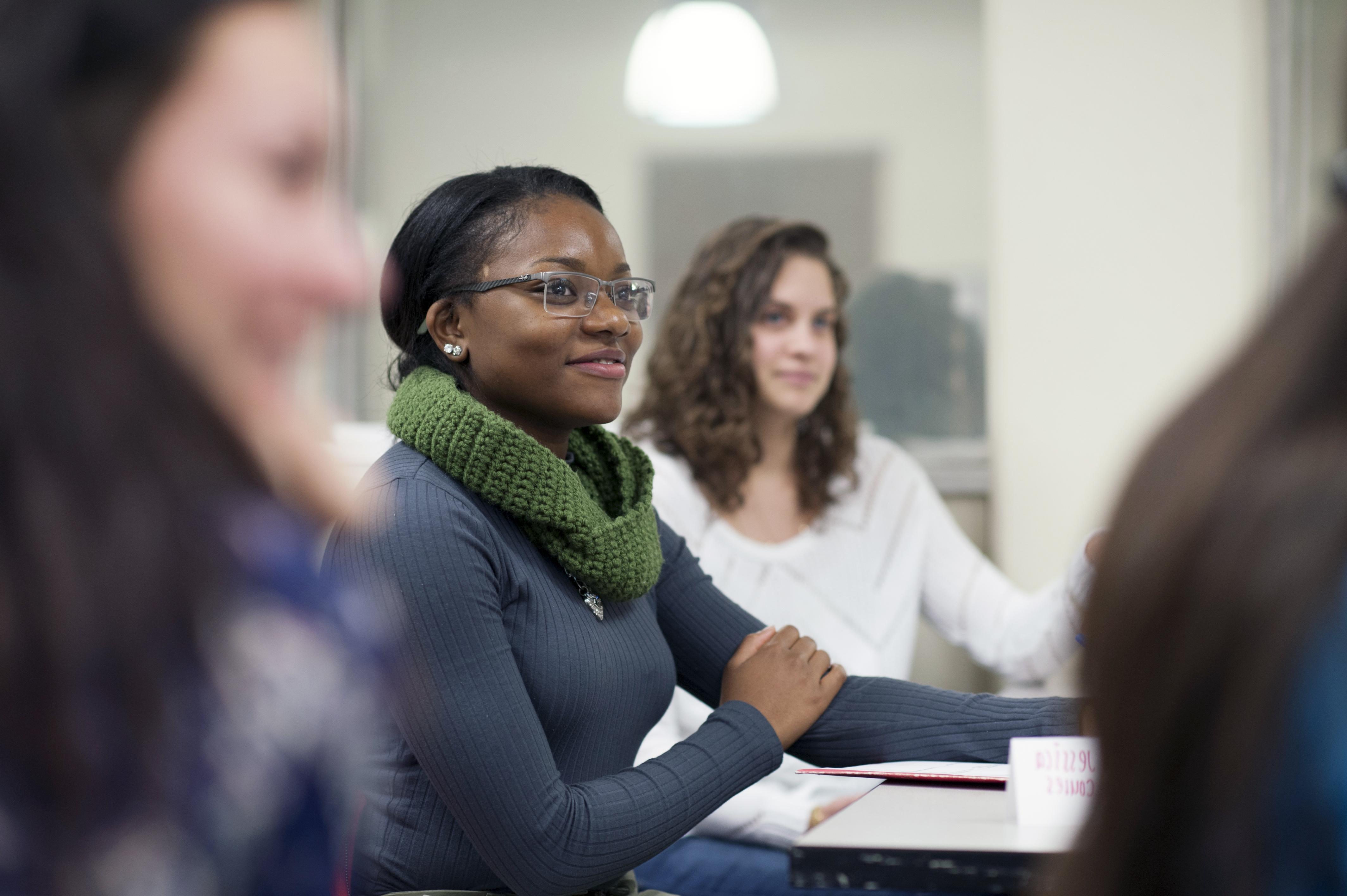 a group of students are writing notes during a lesson